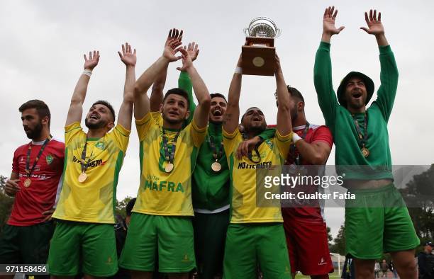 Mafra players and staff members celebrate with trophy after winning the Campeonato de Portugal Final at the end of the Campeonato de Portugal Final...