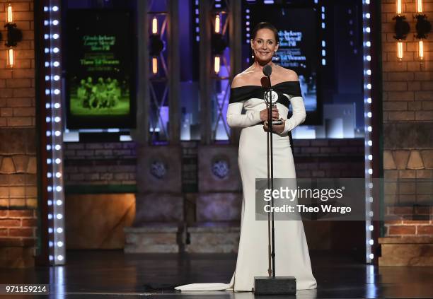 Laurie Metcalf accepts the Best Performance by an Actress in a Featured Role in a Play award for Edward Albee's Three Tall Women onstage during the...