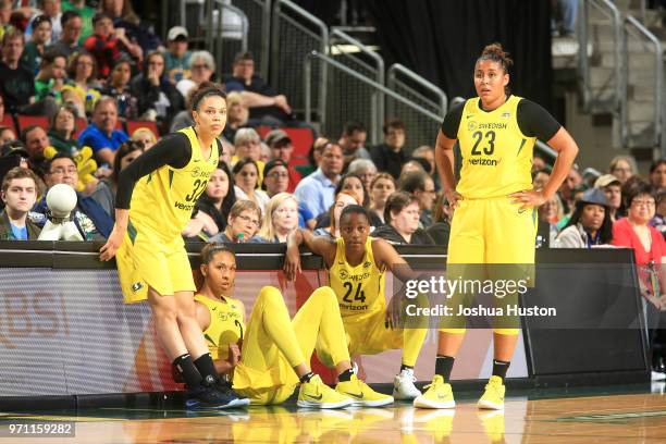 Alysha Clark, Mercedes Russell, Jewell Loyd and Kaleena Mosqueda-Lewis of the Seattle Storm look on during the game against the Atlanta Dream on June...