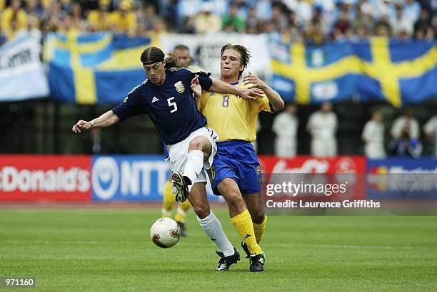 Matias Almeyda of Argentina holds off Anders Svensson of Sweden during the Argentina v Sweden, Group F, World Cup Group Stage match played at the...