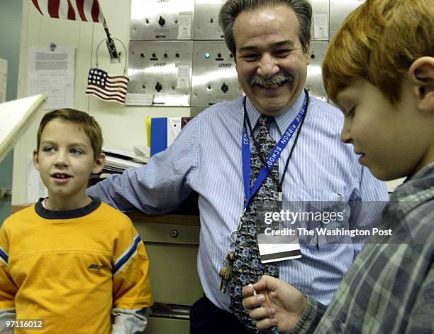 Schoolparty Date: Kevin Clark\The Washington Post Neg #: 173850 Ellicot City, MD Austin Johnson and Jake Balcom receive pencils and a card from...