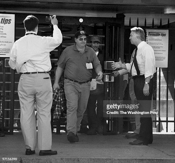 Day in the life of the campaign trail with Mark Earley . This is Earley , shaking hands with employees of Newport News Shipbuilding, at the 37th...