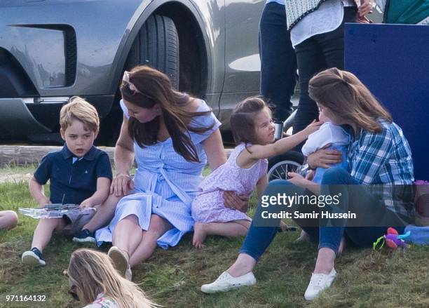 Catherine, Duchess of Cambridge, Prince George of Cambridge and Princess Charlotte of Cambridge attend the Maserati Royal Charity Polo Trophy at...