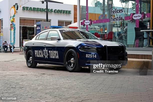 mexican police car on the street - police dodge charger stock pictures, royalty-free photos & images