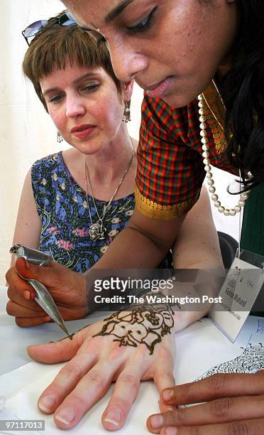The 2003 Zee Heritage India festival is going on at the Moco fairgrounds today and tomorrow. Pictured, Robin Braithwaite, left, of Winchester, Va,...