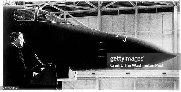 President Reagan speaks to military personnel at a Department of Defense Salute to the President at Andrews Air Force base. Behind him is a B-1...