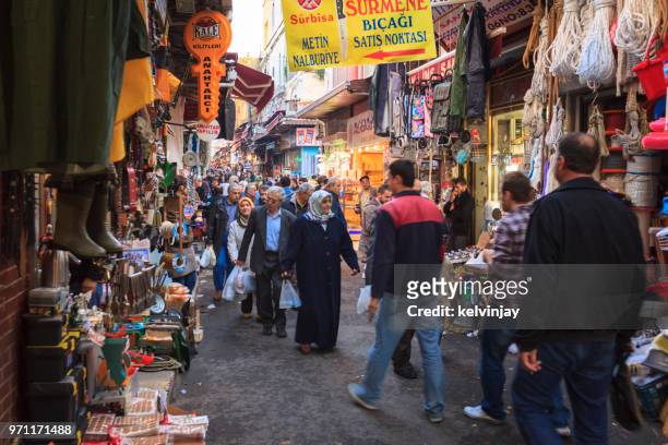 pedestrians walking past shops in the street in istanbul, turkey - kelvinjay stock pictures, royalty-free photos & images