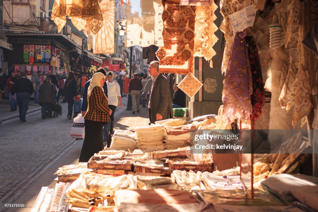 Shopkeeper and customer talking in the street in Istanbul, Turkey