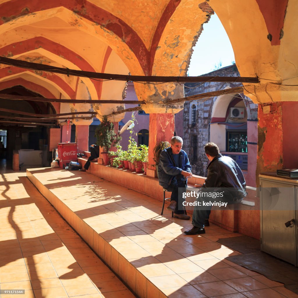 Men chatting in the Grand Bazaar in Istanbul, Turkey