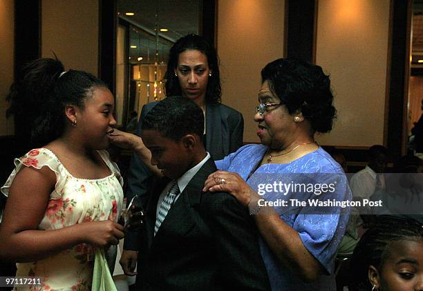 Students of Dolores Hawkins practice what they learned about etiquette at a luncheon at La Fontaine Bleu restaurant. Left to rt: Derricka McDaniel 11...