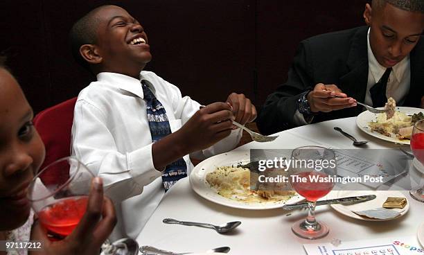 Students of Dolores Hawkins practice what they learned about etiquette at a luncheon at La Fontaine Bleu restaurant. Left to rt: Keenan Lee 12 laughs...