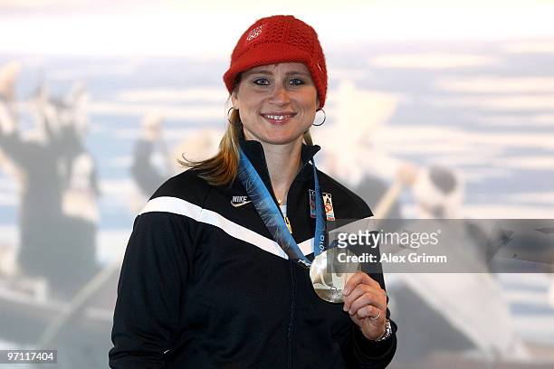 Hockey player Angela Ruggiero of the United States poses with her medal after participating in a VISA Athlete Panel on February 26, 2010 in...