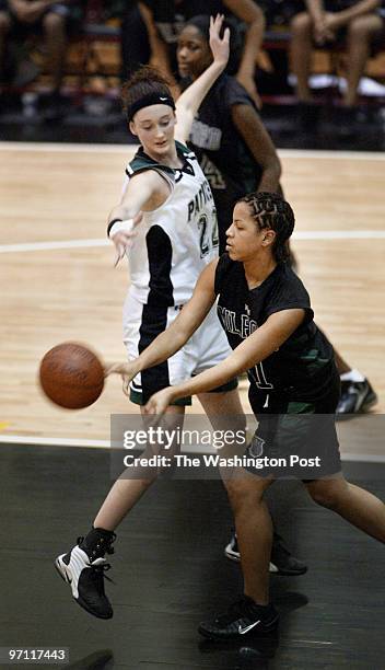 Sm-basket16 3-13-03 Mark Gail/TWP Patuxent's Amanda Robinson trys to stop Milford Mill's Ashley Cates pass to a teammate in the 3A semi-finals at...