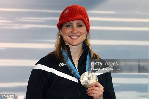 Hockey player Angela Ruggiero of the United States poses with her medal after participating in a VISA Athlete Panel on February 26, 2010 in...