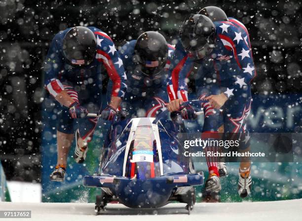 Pilot John Napier , Charles Berkeley, Steven Langton and Christopher Fogt of the United States compete in USA 2 during the four-man bobsleigh heat 1...