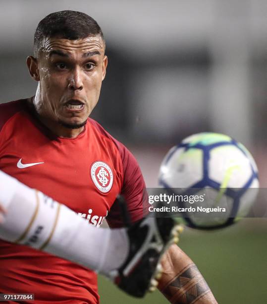 Dodo of Santos battles for the ball with Potker of Internacional during the match between Santos and Internacional as a part of Campeonato Brasileiro...
