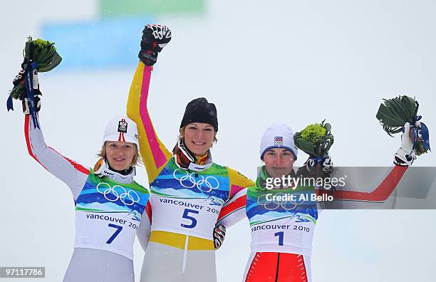 Marlies Schild of Austria, Maria Riesch of Germany and Sarka Zahrobska of Czech Republic celebrate after the conclusion of the Ladies Slalom on day...
