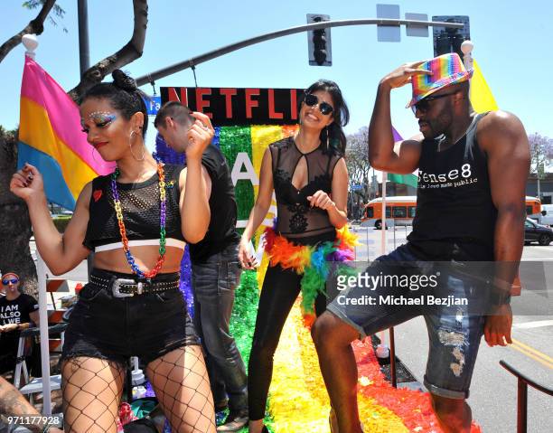 Freema Agyeman, Tina Desai, and Toby Onwumere are seen on the Netflix original series "Sense8" float at the Los Angeles Pride Parade on June 10, 2018...