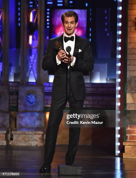 Andrew Garfield accepts the Best Performance by an Actor in a Leading Role in a Play award for Angels in America onstage during the 72nd Annual Tony...