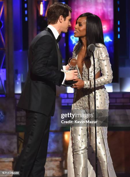 Andrew Garfield accepts the Best Performance by an Actor in a Leading Role in a Play award for Angels in America from Kerry Washington onstage during...