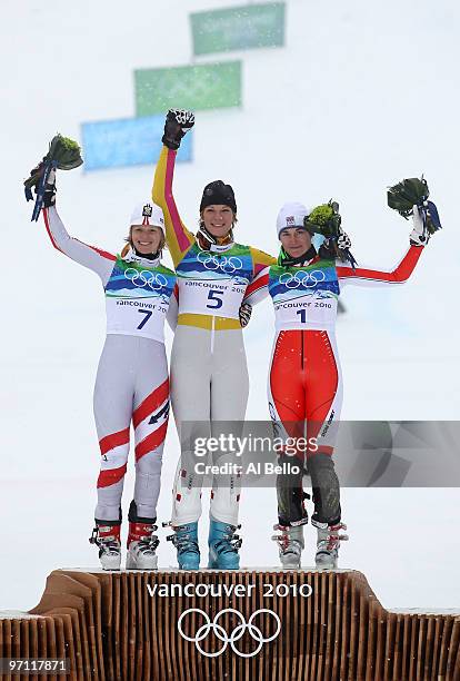 Marlies Schild of Austria, Maria Riesch of Germany and Sarka Zahrobska of Czech Republic celebrate after the conclusion of the Ladies Slalom on day...