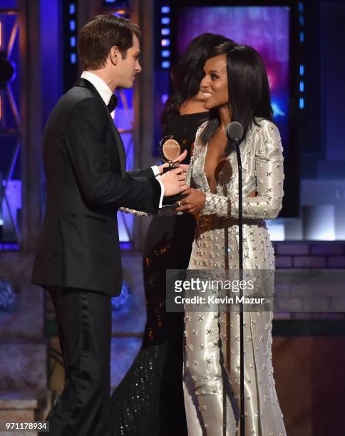 Andrew Garfield accepts the Best Performance by an Actor in a Leading Role in a Play award for Angels in America from Kerry Washington onstage during...