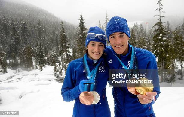 France's medalists Marie-Laure Brunet and Vincent Jay pose at Whistler Olympic Park during the Vancouver Winter Olympics on February 26, 2010. AFP...
