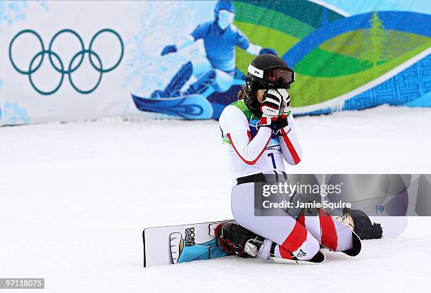 Doris Guenther of Austria reacts after competing in the Snowboard Ladies' Parallel Giant Slalom on day 15 of the Vancouver 2010 Winter Olympics at...