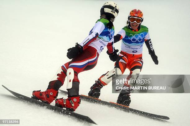 Nicolien Sauerbreij of the Netherlands and Ekaterina Ilyukhina of Russia congratulate each other during the women's Parallel Giant Slalom at Cypress...