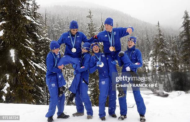 France's biathlon medalists Marie Dorin, Martin Fourcade, Marie Laure Brunet, Sylvie Becaert, Vincent Jay and Sandrine Bailly joke in Whistler on...