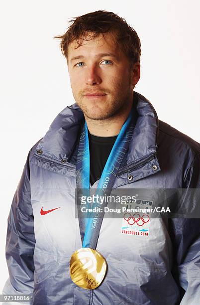 United States alpine skier Bode Miller poses for a photo with his gold medal won in the men's Super Combined during the 2010 Vancouver Winter Olympic...