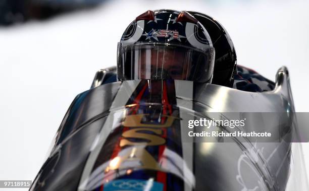 Steven Holcomb, teammates Justin Olsen, Steve Mesler and Curtis Tomasevicz of the Unites States compete in USA 1 during the four-man bobsleigh heat 1...