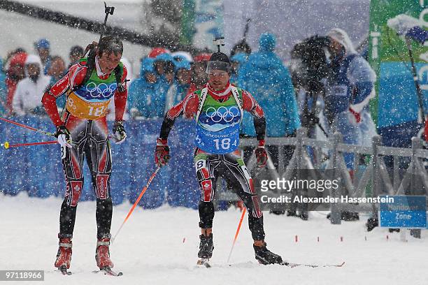 Brendan Green and Jean Philippe Leguellec of Canada compete during the men's 4 x 7.5 km biathlon relay on day 15 of the 2010 Vancouver Winter...