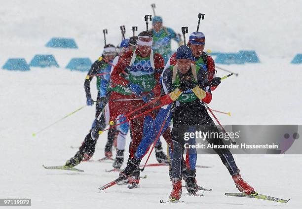 Andreas Birnbacher of Germany leads the pack during the men's 4 x 7.5 km biathlon relay on day 15 of the 2010 Vancouver Winter Olympics at Whistler...