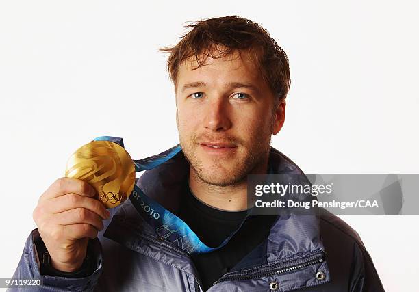 United States alpine skier Bode Miller poses for a photo with his gold medal won in the men's Super Combined during the 2010 Vancouver Winter Olympic...