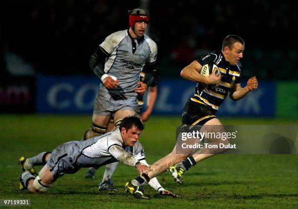 Will Welch of Newcastle Falcons attempts to stop Chris Latham of Worcester Warriors running with the ball during the Guinness Premiership match...