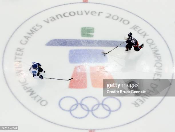 Patrick Kane of the United States moves the puck in the ice hockey men's semifinal game between the United States and Finland on day 15 of the...