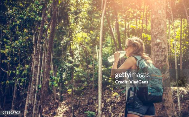 backpacker in rainforest - thai women stock pictures, royalty-free photos & images
