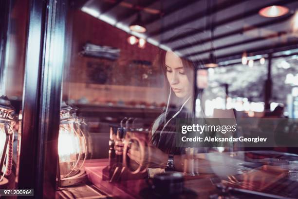 cute female make video conference with smartphone in coffee bar - mp3 juices stock pictures, royalty-free photos & images