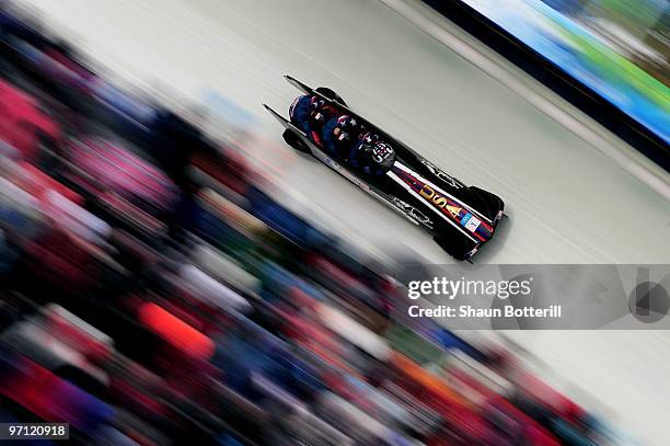 Steven Holcomb, Justin Olsen, Steve Mesler and Curtis Tomasevicz of the Unites States compete in USA 1 during the four-man bobsleigh heat 2 on day 15...