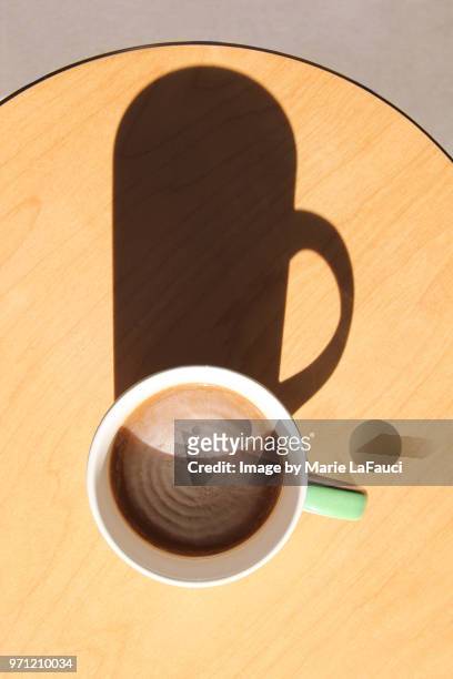 top view of coffee cup on wood table - marie lafauci stock pictures, royalty-free photos & images