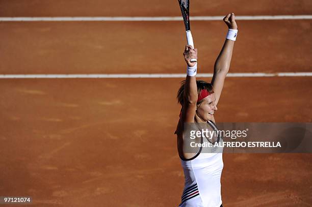 Slovenian tennis player Polona Hercog celebrates her victory over Spanish tennis player Carla Suarez, during the fifth day of the WTA Open in...