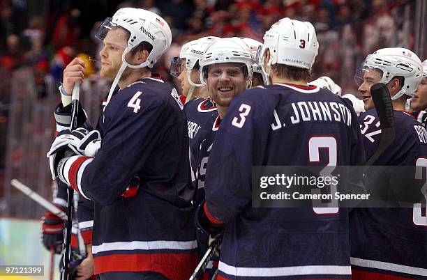 Tim Gleason of the United States and his team mates are seen after the ice hockey men's semifinal game between the United States and Finland on day...