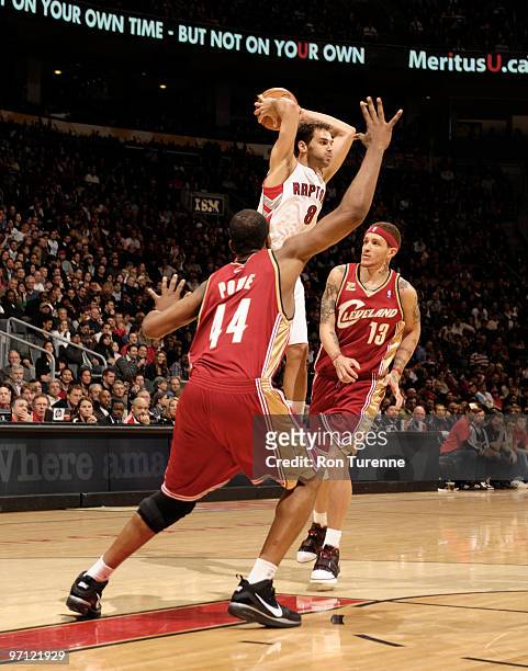 Jose Calderon of the Toronto Raptors passes out of the double team during a game against the Cleveland Cavaliers on February 26, 2010 at the Air...