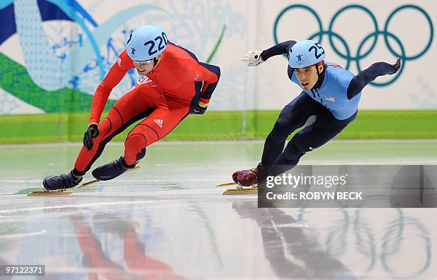 Great Britain's Jon Eley and US' Apolo Anton Ohno compete in the Men's 500 m short-track quaterfinals at the Pacific Coliseum in Vancouver, during...