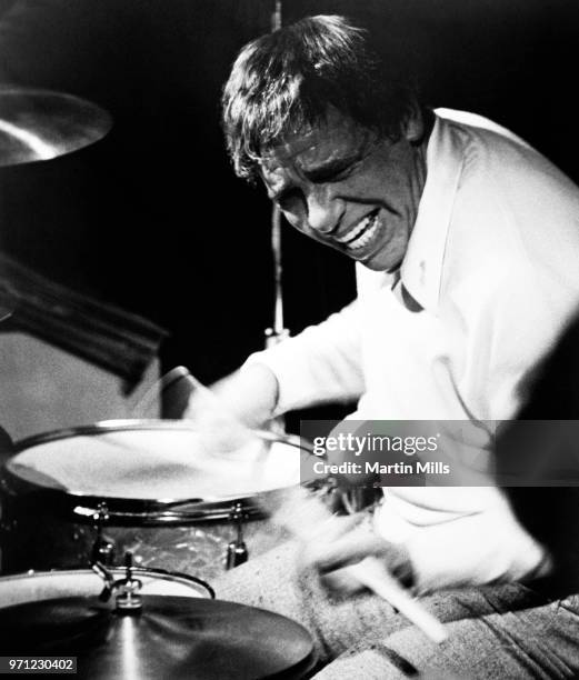 American jazz drummer and bandleader Buddy Rich plays the drums during a concert circa 1970's.