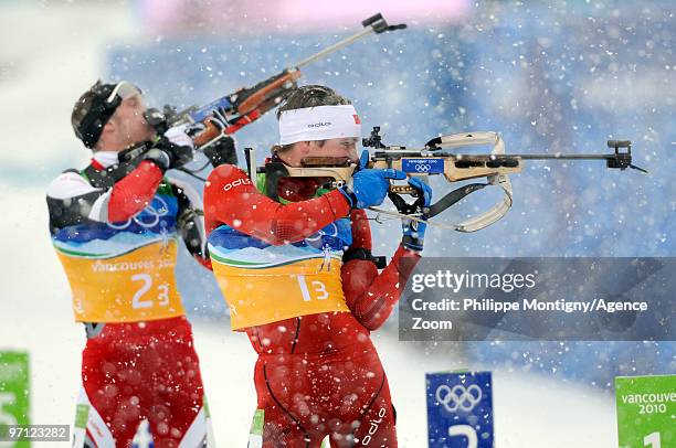 Emil Hegle Svendsen of Norway, Dominik Landertinger of Austria during the MenÕs Biathlon 4x7.5km Relay on Day 15 of the 2010 Vancouver Winter Olympic...