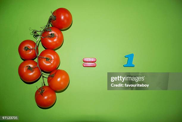 tomatoes equal one a day - イコール ストックフォトと画像