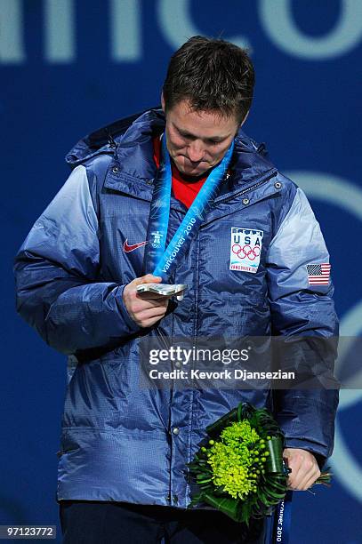 Jeret Peterson of the United States celebrates winning the silver medal during the medal ceremony for the men�s freestyle skiing aerials on day 15 of...