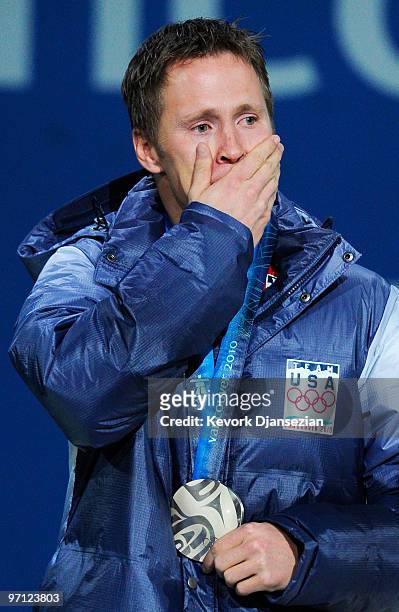Jeret Peterson of the United States celebrates winning the silver medal during the medal ceremony for the men�s freestyle skiing aerials on day 15 of...